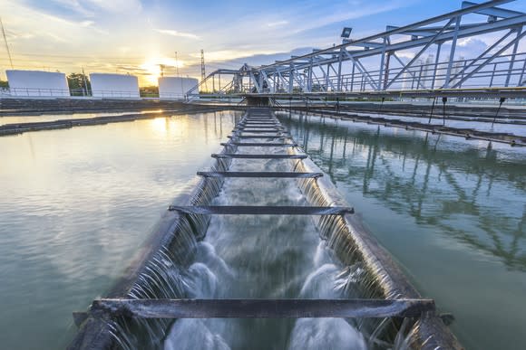 A water treatment plant at sunset.