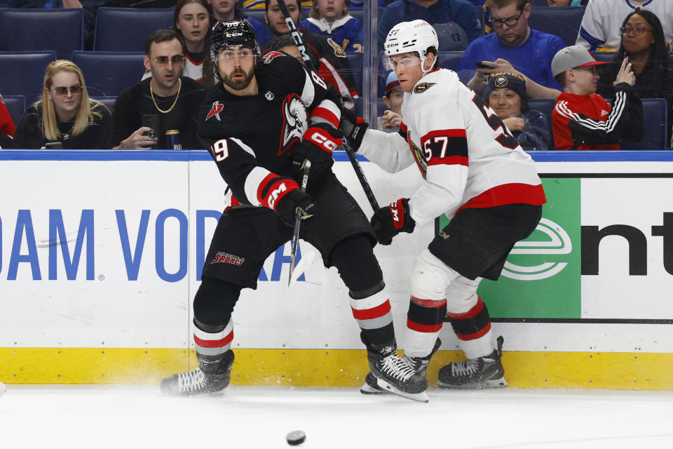 Buffalo Sabres right wing Alex Tuch (89) is checked by Ottawa Senators center Shane Pinto (57) during the first period of an NHL hockey game, Thursday, April 13, 2023, in Buffalo, N.Y. (AP Photo/Jeffrey T. Barnes)