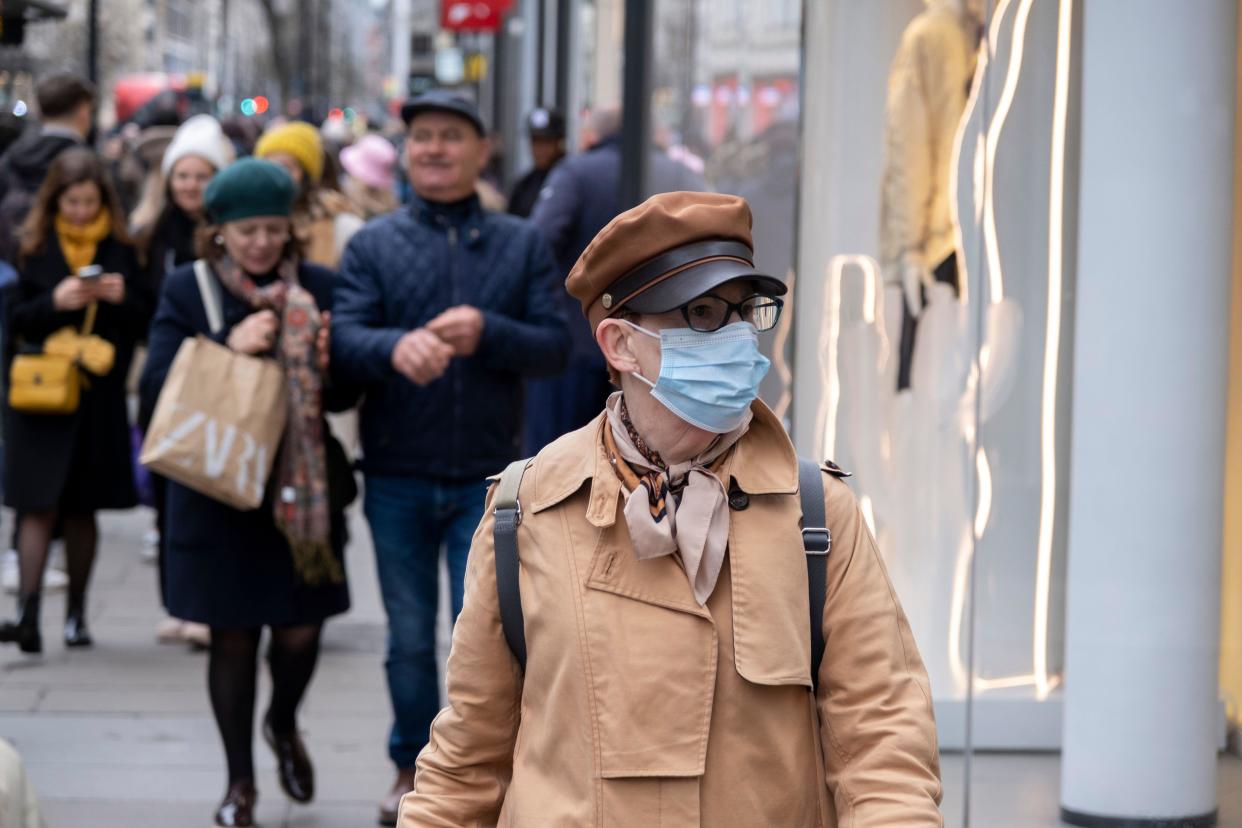Person wearing a face mask to protect against Coronavirus / Covid-19 on 26th March 2023 in London, United Kingdom. The usage of face coverings in public places is very much reduced since rates of infection dropped and the fear of the pandemic decreased. Despite this, mask usage still continues to some degree.