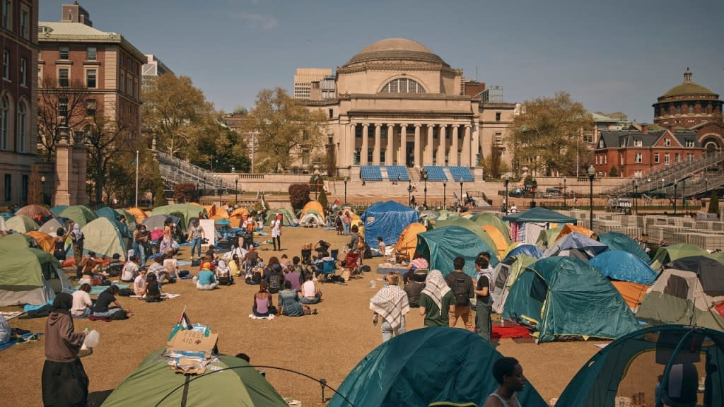 People listen to a speaker at a pro-Palestinian encampment, advocating for financial disclosure and divestment from all companies tied to Israel and calling for a permanent cease-fire in Gaza, at Columbia University on Sunday in New York. (Photo: Andres Kudacki/AP