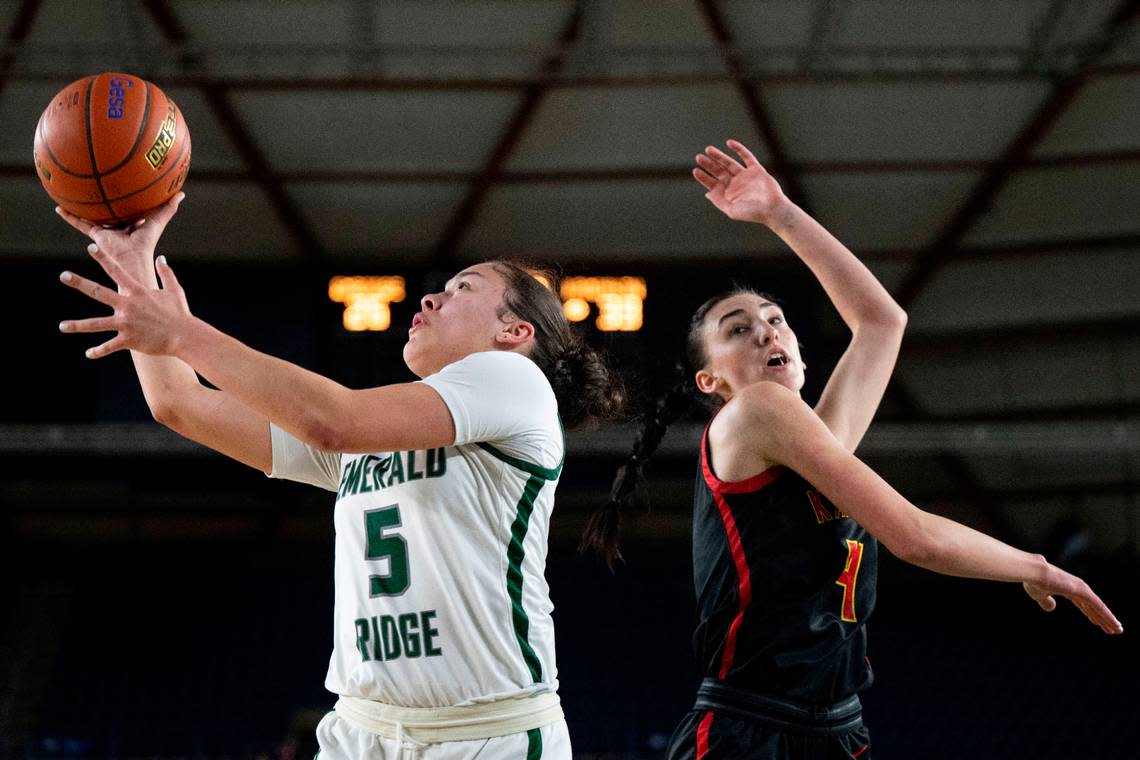 Emerald Ridge guard Monique Carter (5) attempts a shot as Kamiakin guard Maddy Rendall (4) defends during the third quarter of a Class 4A quarterfinal game on Thursday, March 2, 2023, in Tacoma, Wash.