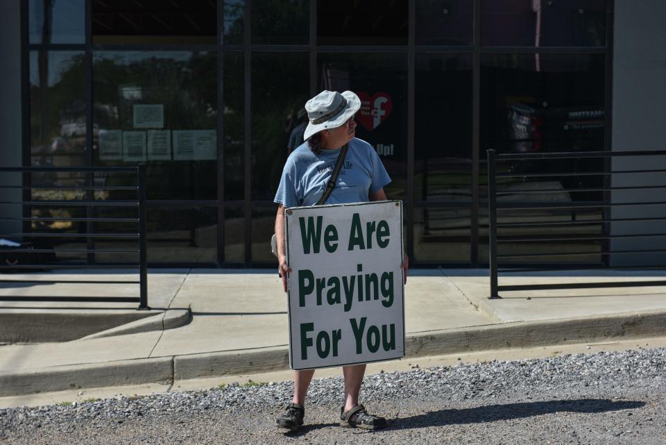 Doug Heiser, an anti-abortion advocate, holds a sign at the Jackson Women's Health Organization after the U.S. Supreme Court overturned Roe v. Wade in Jackson, Miss., Friday, June 24, 2022.