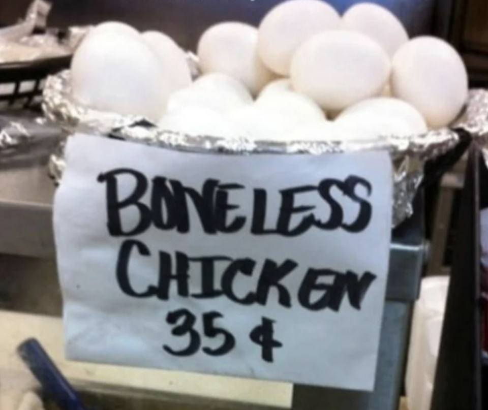 boneless chicken sign in front of eggs