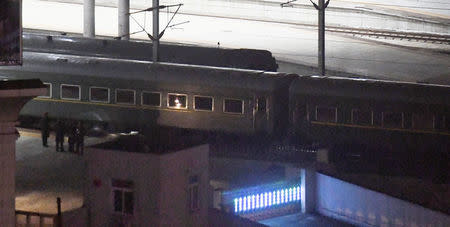 A train believed to be carrying North Korean leader Kim Jong Un leaves from a train station in the Chinese border city of Dandong, China in this photo taken by Kyodo on February 23, 2019. Mandatory credit Kyodo/via REUTERS