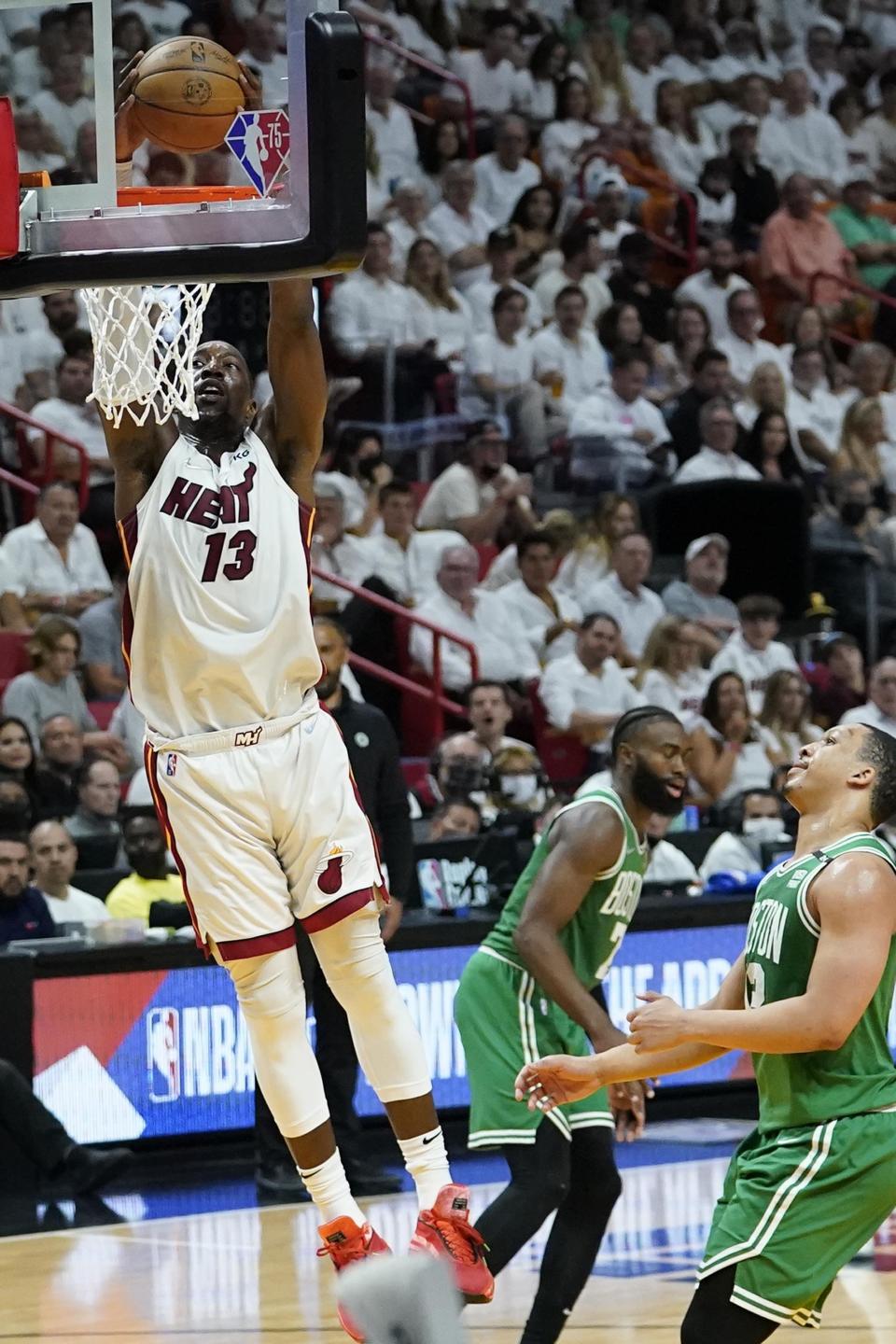 Miami Heat center Bam Adebayo (13) dunks the ball during the first half of Game 2 of the NBA basketball Eastern Conference finals playoff series against the Boston Celtics, Thursday, May 19, 2022, in Miami. (AP Photo/Lynne Sladky)