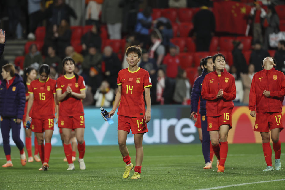 China women soccer team members walk on the field after the Women's World Cup Group D soccer match between China and England in Adelaide, Australia, Tuesday, Aug. 1, 2023. (AP Photo/James Elsby)