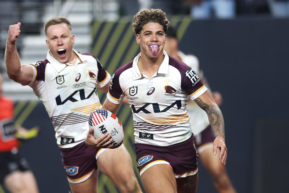 Reece Walsh celebrates a try.