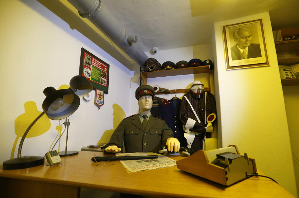 A dummy of a policeman is placed at a desk as part of an installation at the nuclear shelter from Cold War era at five star Jalta Hotel in downtown Prague, Czech Republic, Wednesday, Dec. 4, 2013. To mark the 55th anniversary, the hotel began to turn the bunker into an Iron Curtain museum whose first part was opened to the public in Nov. 2013. (AP Photo/Petr David Josek)