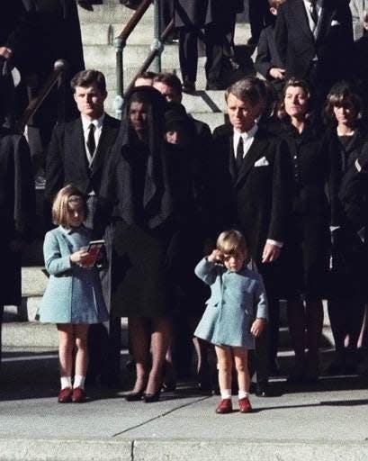 Three-year-old John F. Kennedy Jr. salutes his father’s casket in Washington on Nov. 25, 1963, three days after the president was assassinated in Dallas. Widow Jacqueline Kennedy, center, and daughter Caroline Kennedy are accompanied by the late president’s brothers Sen. Edward Kennedy, left, and Attorney General Robert Kennedy.