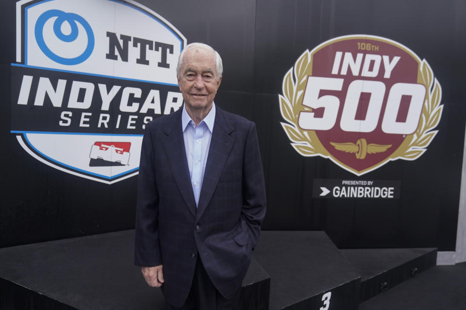 Roger Penske stands on the victory podium before practice for the Indianapolis 500 auto race at Indianapolis Motor Speedway, Thursday, May 19, 2022, in Indianapolis. His father took him to the seats in 1951 and a 14-year-old Penske was instantly hooked by the sights and the sounds of "The 500-Mile Sweepstakes" won that day by Lee Wallard. (AP Photo/Darron Cummings)