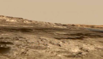 This screenshot from an animated NASA video shows the Murray Buttes, a cluster of steep formations near the base of Mars' Mount Sharp.