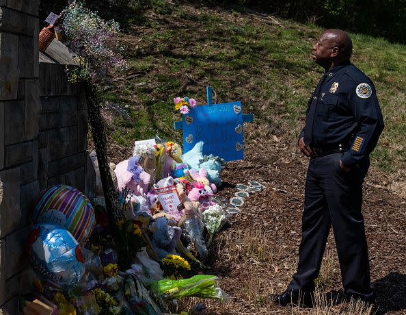 NASHVILLE, TN - MARCH 28: Chief of Police John Drake looks at memorial items left at the entrance of The Covenant School on March 28, 2023 in Nashville, Tennessee before a press briefing. According to reports, three students and three adults were killed by the 28-year-old shooter on Monday.  (Photo by Seth Herald/Getty Images)