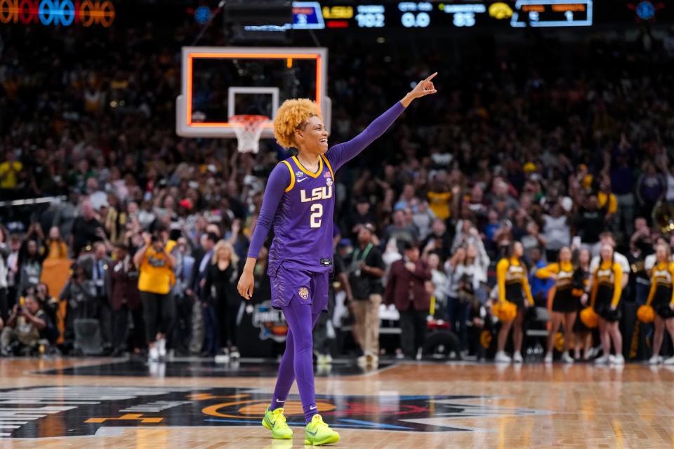 Guard Jasmine Carson acknowledges the crowd after LSU defeated Iowa for the school's first NCAA women's basketball title.