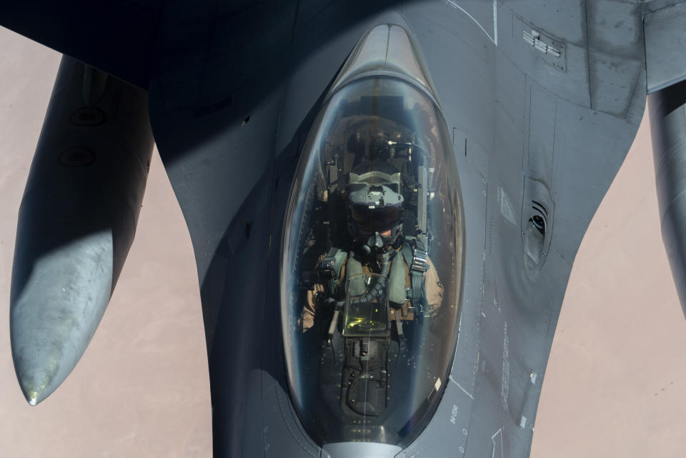 U.S. Air Force F-16 Fighting Falcon is aerial refueled by a KC-135 “Stratotanker” over the U.S. Central Command area of responsibility Wednesday, Dec. 30, 2020 as part of an escort mission in support of the B-52 “Stratofortress” deployment. The United States flew strategic bombers over the Persian Gulf on Wednesday for the second time this month, a show of force meant to deter Iran from attacking American or allied targets in the Middle East. (Senior Airman Roslyn Ward/U.S. Air Force via AP)