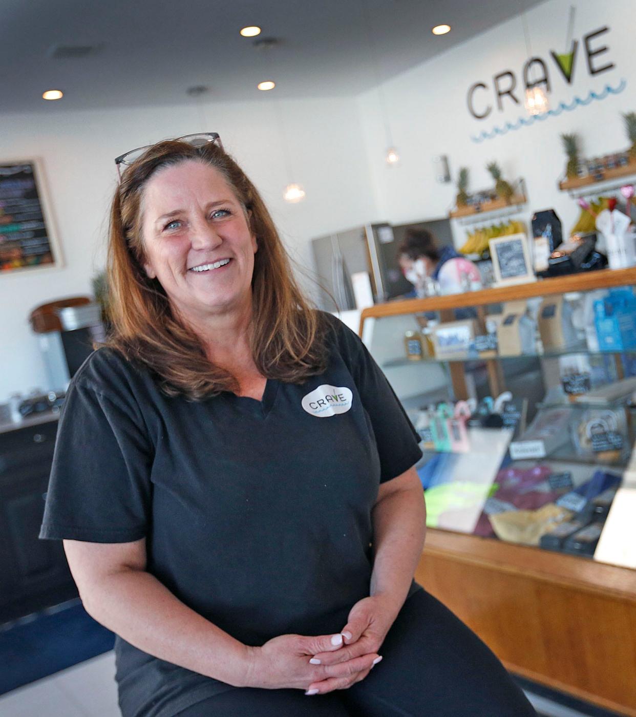 Hull business owner Casey Mahoney in Crave, her Nantasket Avenue shop that serves coffee and smoothies along with other treats, Monday, Jan. 31, 2022.