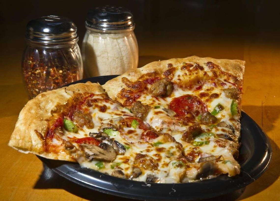 Two slices of supreme pizza at Fatty’s Pizza.