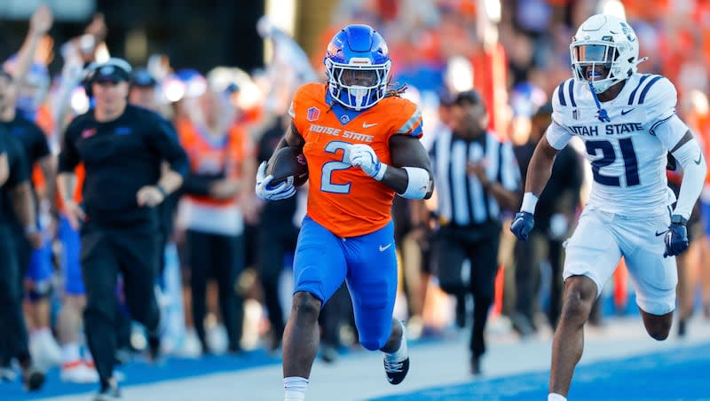 Boise State running back Ashton Jeanty (2) rushes for a 75-yard touchdown run from Utah State safety Malik McConico during the first half of an NCAA college football game on Saturday, Oct. 5, 2024, in Boise, Idaho (21) of them .