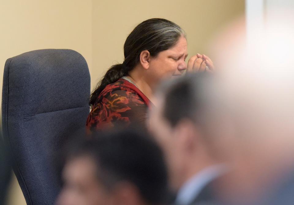 Christine Fenton Gilbert, of Fort Pierce, sits in a holding room after being sentenced, fingerprinted and hand cuffed in the Martin County Courthouse in Stuart for charges related to altering more than a dozen scratch-off Florida Lottery tickets, including one worth $20,000 that she admitted buying because she knew it was a winner. Circuit Judge William Roby sentenced Fenton-Gilbert to 18 months in prison, followed by 13 years of probation after being released from prison, and ordered Fenton-Gilbert to pay $20,000 in restitution to the Florida Lottery and $1,196 to the Rebel Store in Jensen Beach, where she worked.