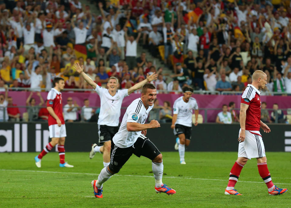 L'VIV, UKRAINE - JUNE 17: Lukas Podolski of Germany celebrates scoring their first goal during the UEFA EURO 2012 group B match between Denmark and Germany at Arena Lviv on June 17, 2012 in L'viv, Ukraine. (Photo by Alex Livesey/Getty Images)