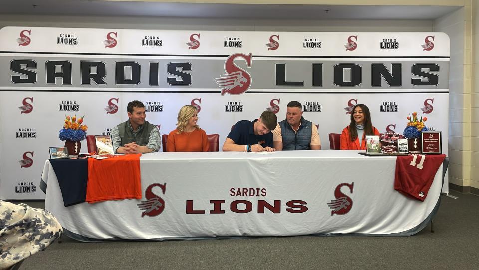 Sardis football player Eli Morton signs with Auburn as an PWO inside the schools library on Thursday, March 7, 2024.