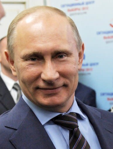 Russia's Prime Minister Vladimir Putin smiles as he visits the "Vybory 2012" (Elections 2012) situation centre in Moscow. The Russian opposition Tuesday defiantly vowed to wage a sustained campaign of protests after police detained hundreds in rallies against Putin's crushing victory in presidential polls