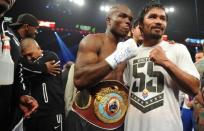 Timothy Bradley (L) of the US celebrates his victory over Manny Pacquiao of the Philippines following their WBO welterweight title match at the MGM Grand Arena, on June 9, in Las Vegas, Nevada. Unbeaten Bradley ended Pacquiao's long unbeaten run with a controversial split decision victory over the Filipino ring icon