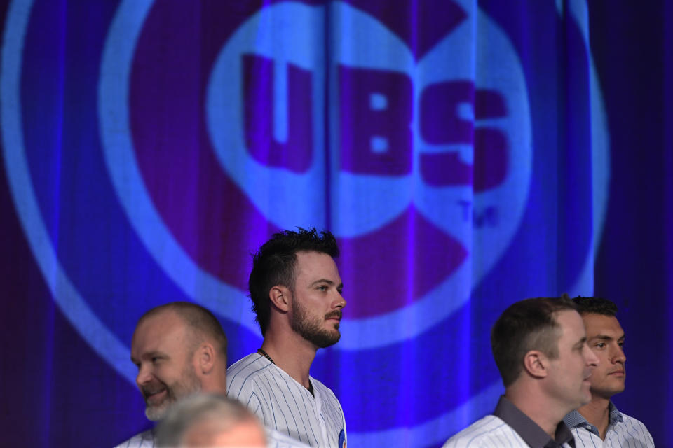 Chicago Cubs' Kris Bryant, center, looks on during the baseball team's convention, Friday, Jan. 17, 2020, in Chicago. (AP Photo/Paul Beaty)