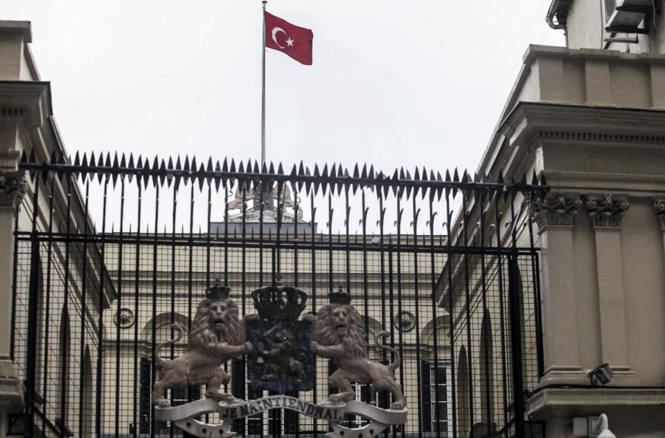 A Turkish flag flies over the Dutch consulate in Istanbul shortly after a man climbed onto the roof and replaced the Netherlands' flag with the Turkish one, Sunday, March 12, 2017. The escalating dispute between Turkey and the Netherlands spilled over into Sunday, with a Turkish minister unable to enter her consulate after the authorities there had already blocked a visit by the foreign minister, prompting Turkish President Recep Tayyip Erdogan to call the Dutch " fascists." (AP Photo)