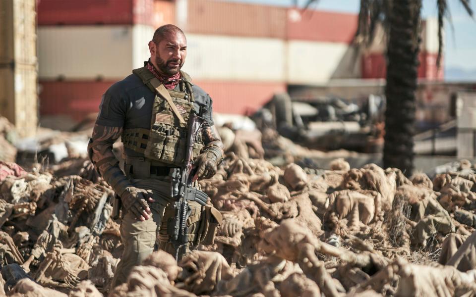 Dave Bautista mows down the shambling hordes in Army of the Dead - Clay Enos
