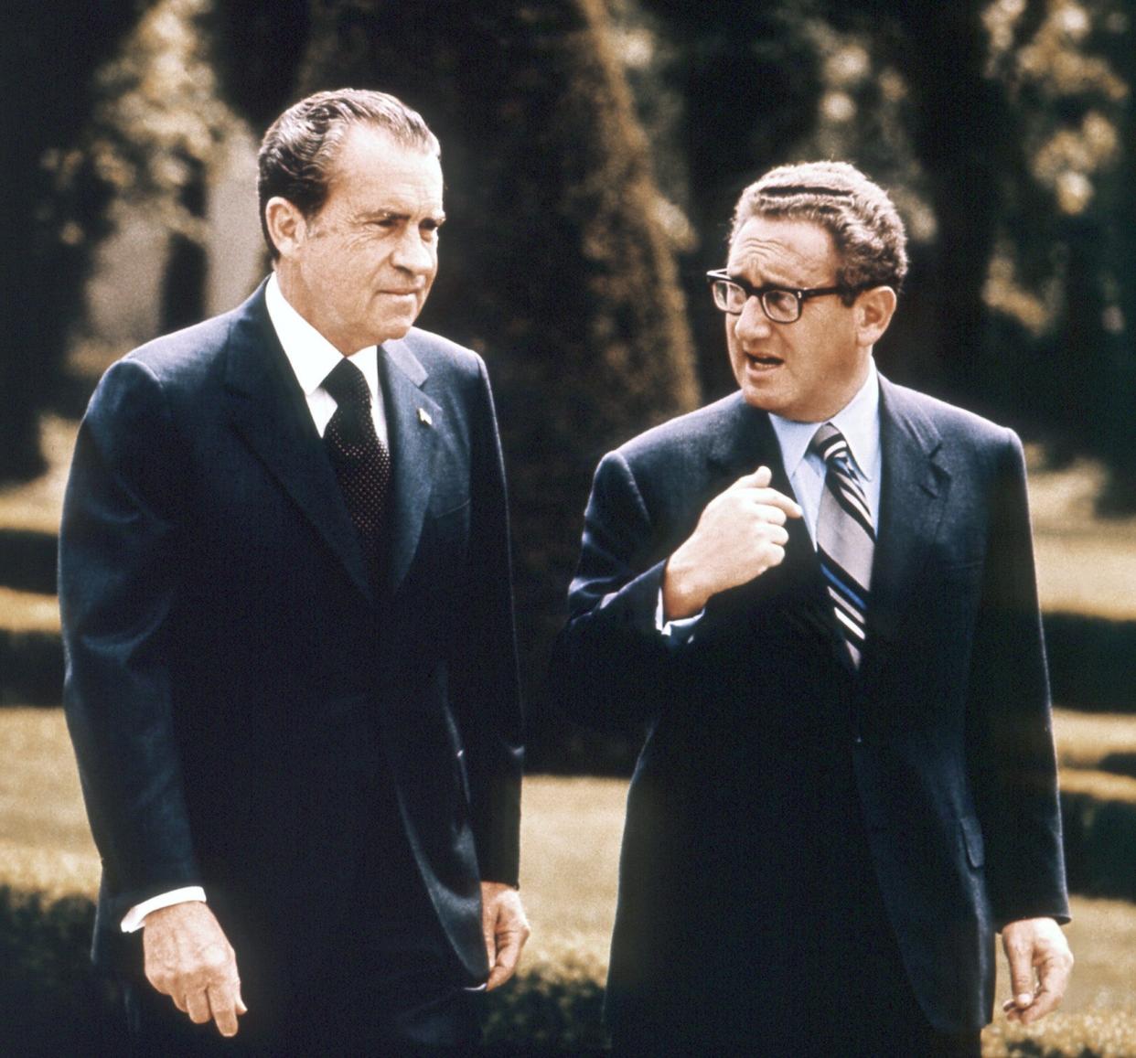 President Richard Nixon and National Security Advisor Henry Kissinger walk during a visit to Vienna, Austria in May 1972.