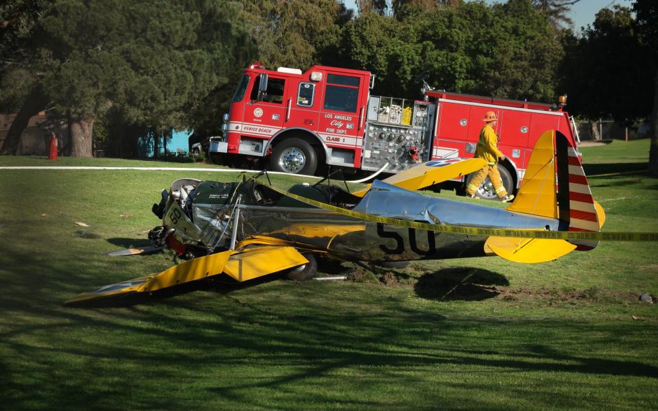 A small plane owned by Harrison Ford is seen after crashing at the Penmar Golf Course in Venice, California in 2015 - Credit: AFP