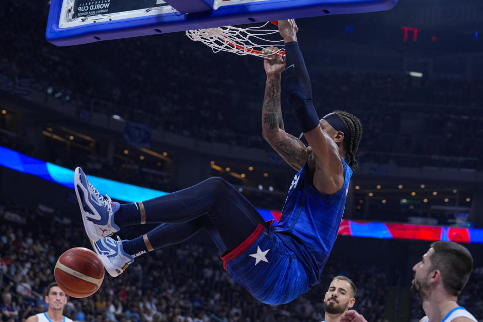 U.S. forward Paolo Banchero (8) gets dunk against Greece during the first half of a Basketball World Cup group C match in Manila, Philippines Monday, Aug. 28, 2023.(AP Photo/Michael Conroy)