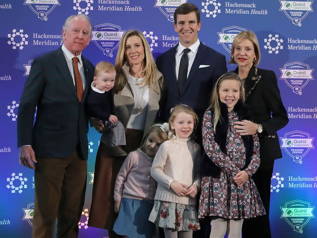 <p>Elsa/Getty</p> Eli Manning with his family after he announced his retirement during a press conference on January 24, 2020.
