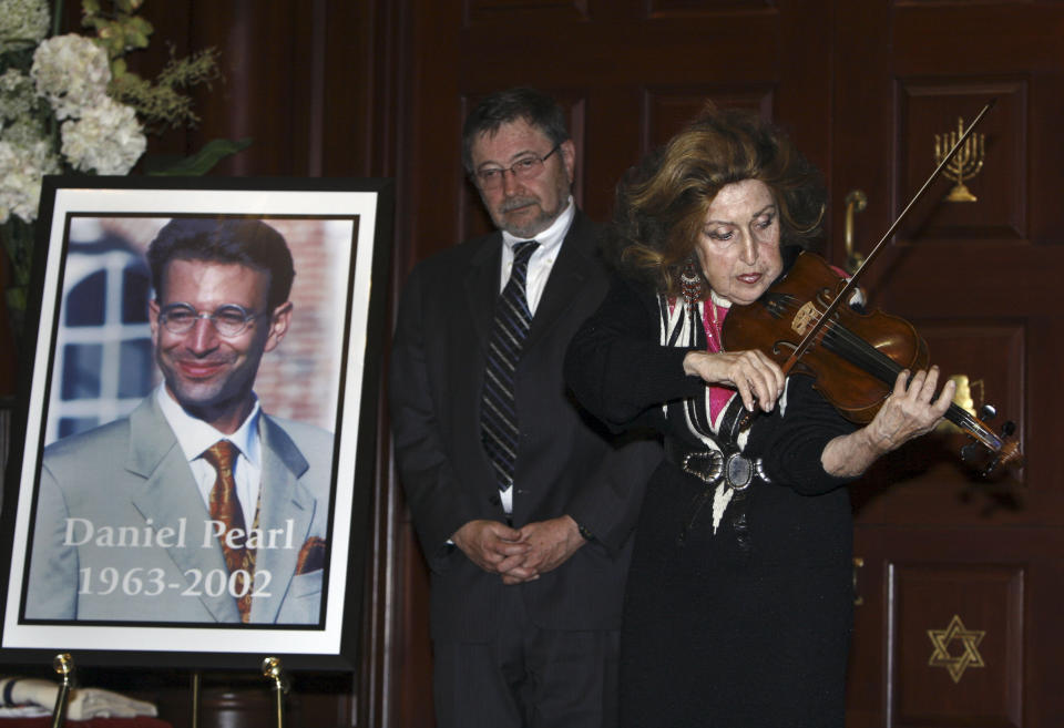 FILE - In this April 15, 2007, file photo, Dr. Judea Pearl, father of American journalist Daniel Pearl, who was killed by terrorists in Pakistan in 2002, listens to violinist Ida Haendel in Miami Beach, Fla. Emma Kostyun, a recent graduate of Pittsfield, Mass. High School, whose love of music developed into a love of the written word and a passion for journalism, was named Wednesday, June 16, 2021, the 2021 recipient of a college scholarship founded in honor of slain Wall Street Journal reporter Daniel Pearl. (AP Photo/Wilfredo Lee, File)