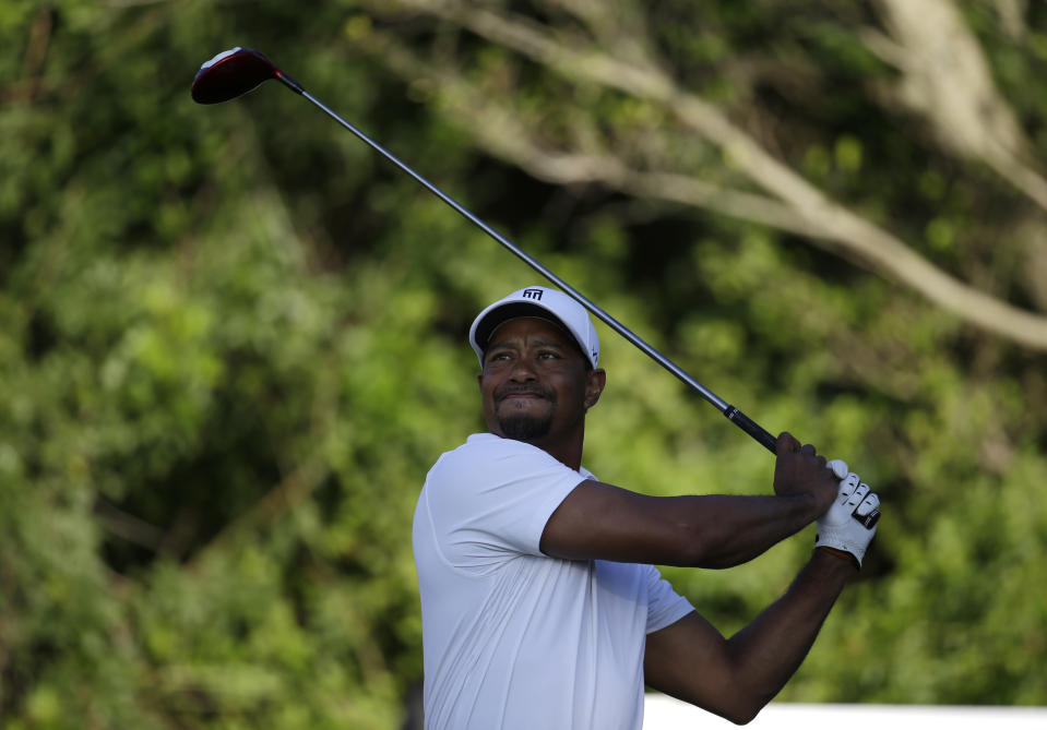 Tiger Woods tees off on the third hole during the third round of the Honda Classic golf tournament, Saturday, March 1, 2014, in Palm Beach Gardens, Fla. (AP Photo/Lynne Sladky)