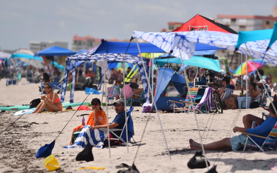 Crowds on the beach in Cape Canaveral came for the Artemis launch, but stayed for the beach after scrub.  