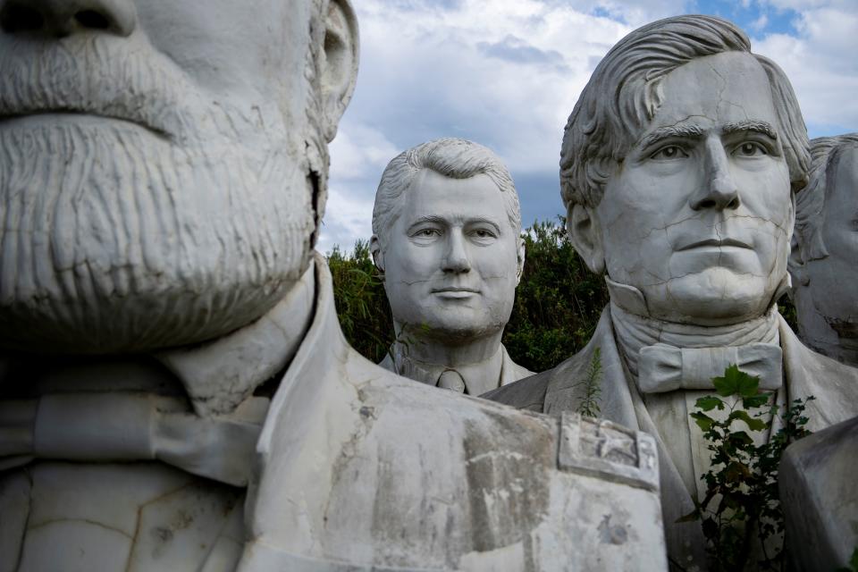 A bust of former US President Bill Clinton(C) can be seen among other busts of former US Presidents at a mulching business where they now reside August 25, 2019, in Williamsburg, Virginia.(Photo: Brendan Smialowski/AFP/Getty Images)