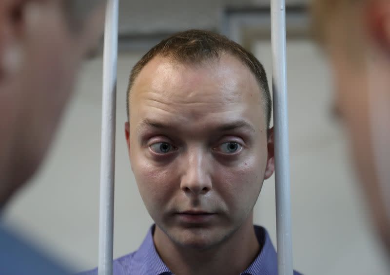 Ivan Safronov, a former journalist who works as an aide to the head of Russia's space agency Roscosmos, detained on suspicion of treason attends a court hearing in Moscow