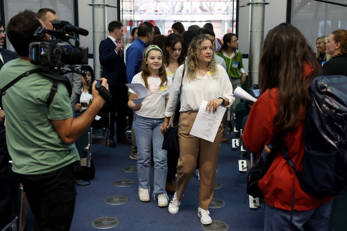 Young Portuguese citizens (centre) arrive at the European Court of Human Rights (ECHR) for a hearing in a climate change case involving themselves against 32 countries, in Strasbourg, eastern France (AFP via Getty Images)