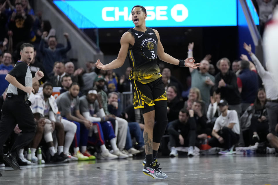Golden State Warriors guard Jordan Poole (3) celebrates after making a 3-point basket during the second half o an NBA basketball game against the Los Angeles Clippers in San Francisco, Thursday, March 2, 2023. (AP Photo/Jeff Chiu)