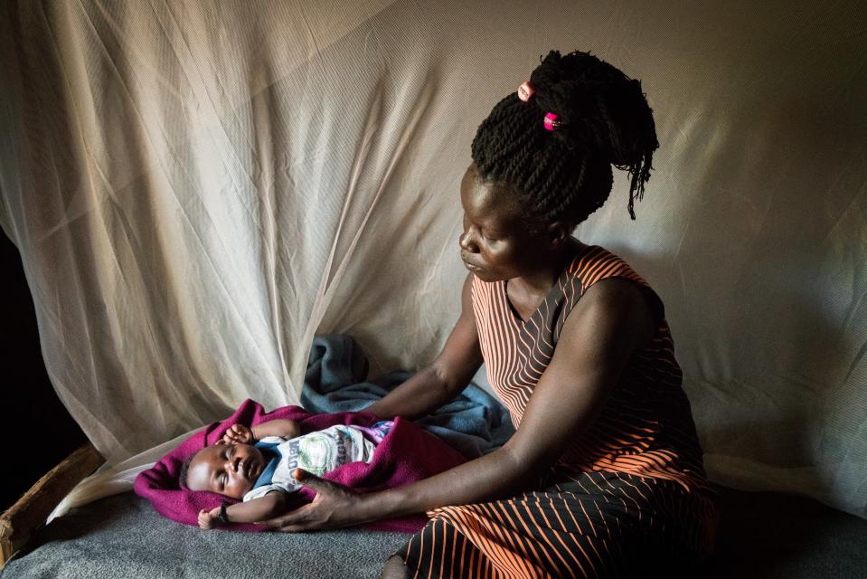 Stella Keji, 18, with her son Nelson in their home in the Bidi Bidi settlement for refugees who have fled from South Sudan to Uganda.