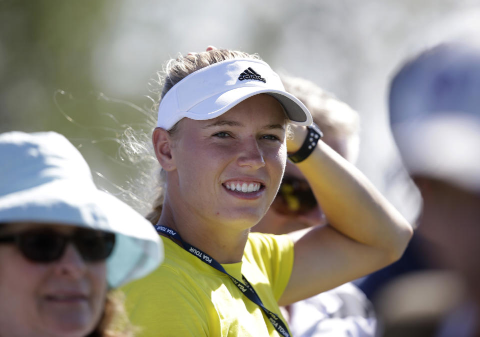 Tennis player Caroline Wozniacki watches her fiancee Rory McIlroy play on the sixth hole during the third round of the Honda Classic golf tournament, Saturday, March 1, 2014 in Palm Beach Gardens, Fla. (AP Photo/Wilfredo Lee)