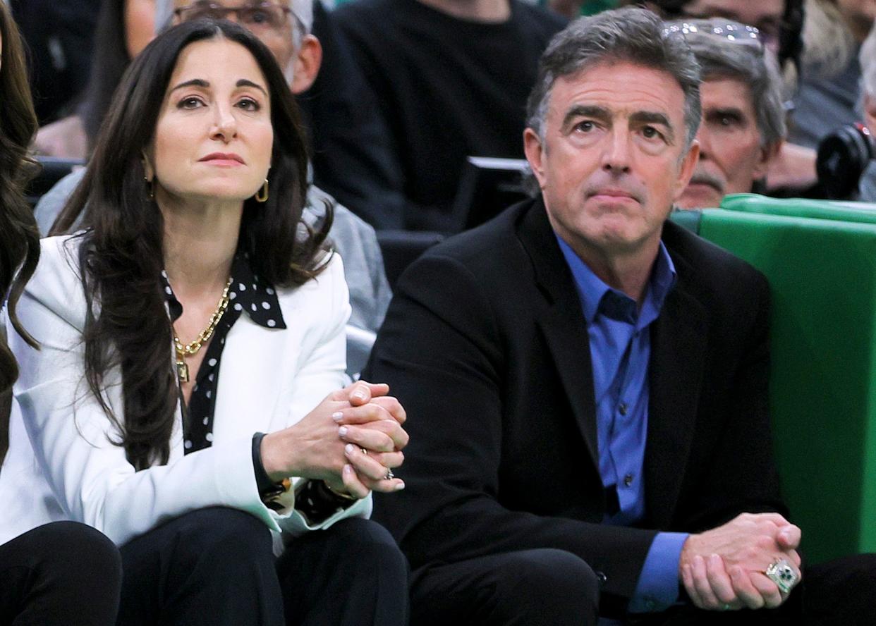 Emilia Fazzalari and Wyc Grousbeck watch a game at TD Garden between the Celtics and the Miami Heat in November 2022.