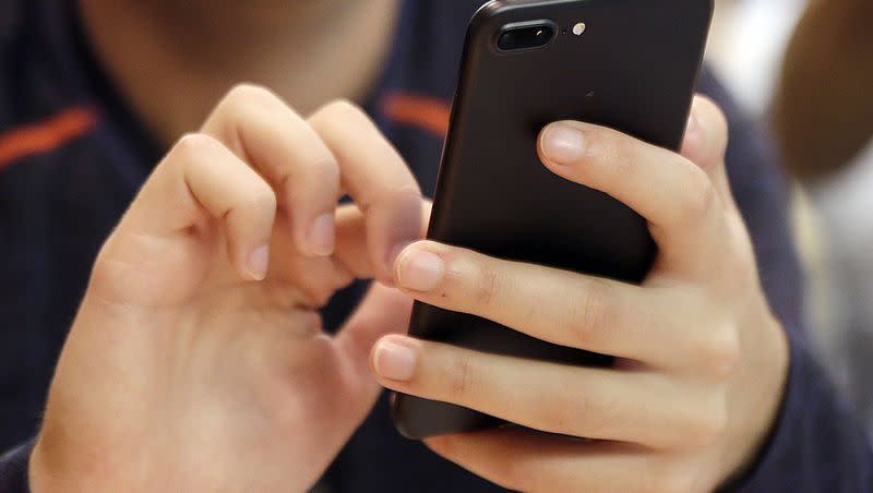 A person uses a smartphone in Chicago in this 2017 file photo. 