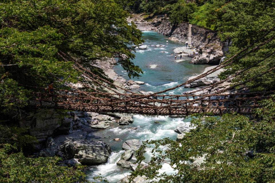 <div class="inline-image__caption"><p>The kazurabashi suspension bridge made entirely of tree vine hovering over the Iya River.</p></div> <div class="inline-image__credit">John S. Lander via Getty Images</div>
