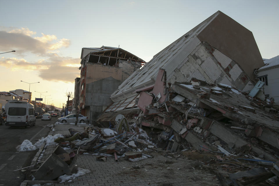 Collapsed buildings in Golbasi, in Adiyaman province, southern Turkey, Wednesday, Feb. 8, 2023. Thinly stretched rescue teams worked through the night in Turkey and Syria, pulling more bodies from the rubble of thousands of buildings toppled by a catastrophic earthquake. The death toll rose Wednesday to more than 10,000, making the quake the deadliest in more than a decade. (AP Photo/Emrah Gurel)