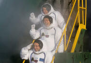 The International Space Station (ISS) crew members Norishige Kanai of Japan (C), Anton Shkaplerov of Russia (bottom) and Scott Tingle of the U.S. board the Soyuz MS-07 spacecraft for its launch at Baikonur Cosmodrome, Kazakhstan December 17, 2017. REUTERS//Shamil Zhumatov TPX IMAGES OF THE DAY