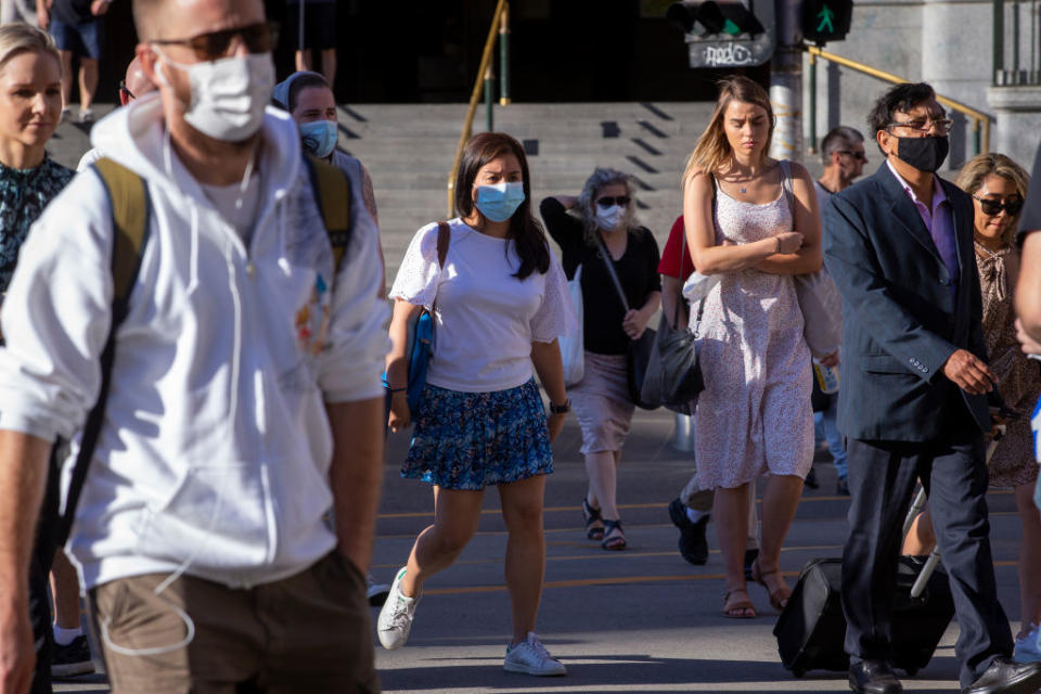 People walking with face masks on during the coronavirus pandemic.
