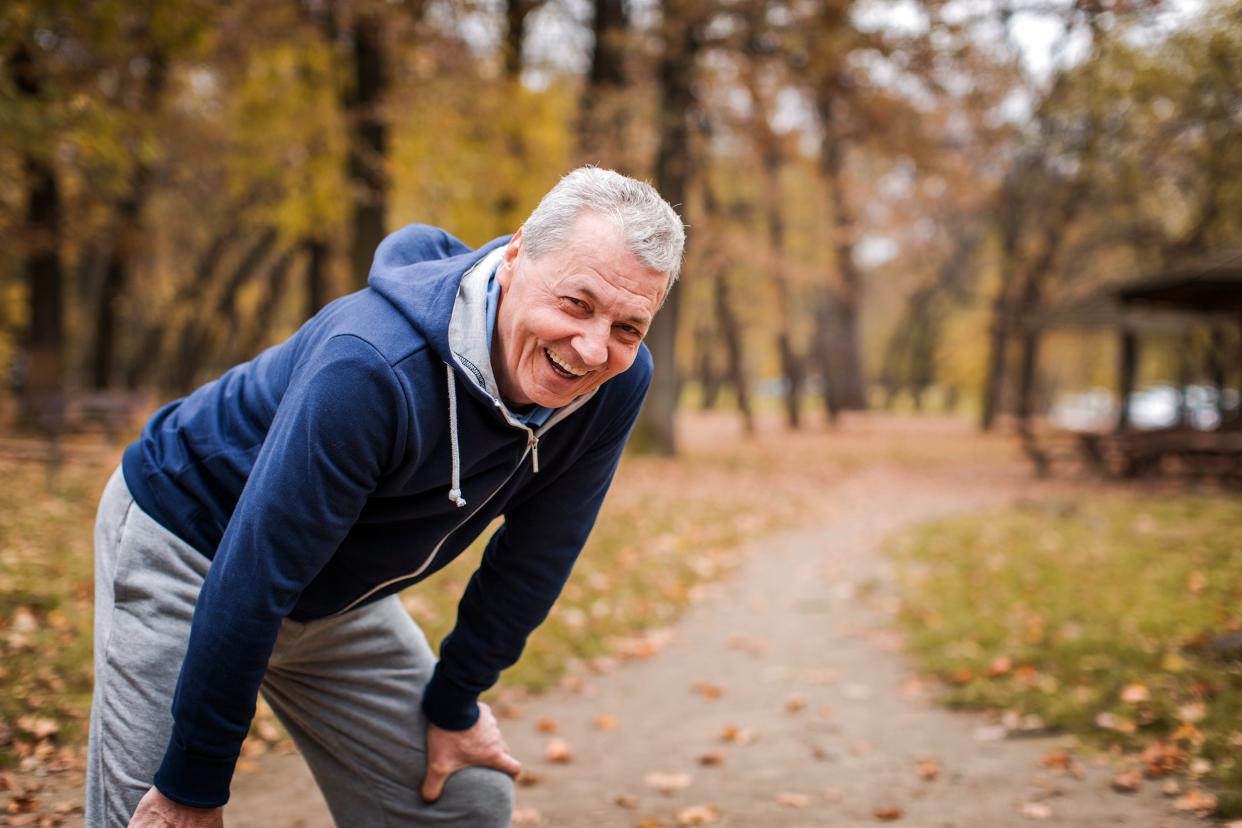 Man taking a break from exercising outside