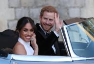 <p>Markle showed off her aquamarine ring gifted from Prince Harry on their wedding day on 19 May 2018 as they sped off in a converted Jaguar to their wedding reception festivities. They couldn't look happier. </p>